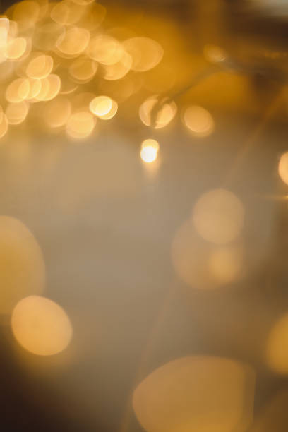 istock abstract shiny gold background. blured bokeh glowing golden background for design with copyspace. Shiny illumination lights 1467849253
