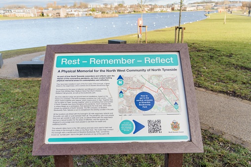 Killingworth, United Kingdom – February 11, 2023: Signage for the Covid-19 memorial at Lakeside Park in the New Town of Killingworth, North Tyneside, UK, one of 5 in the borough