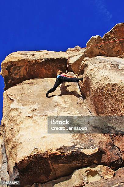 Awesome Female Climber Stemming Stock Photo - Download Image Now - Athlete, Blue, California