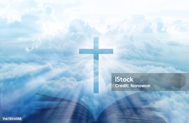 Christian Cross With Open Book On The Blue Sky Stock Photo - Download Image Now - Book, Heaven, Bible