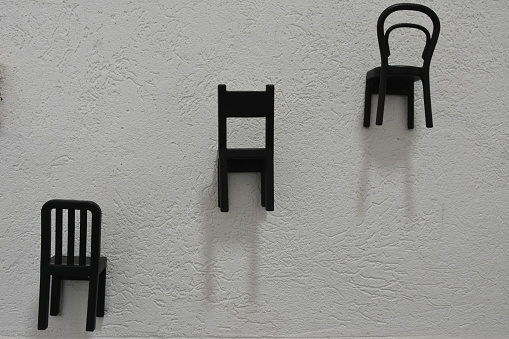 Chairs hang on the wall