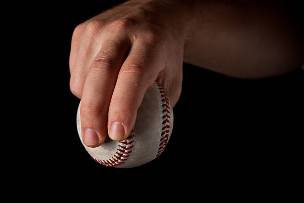 istock Man Gripping a Baseball - Slider 146785714