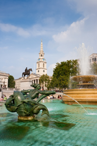 Ponds with statue and fountain on a Trafalgar Square. London, UK
