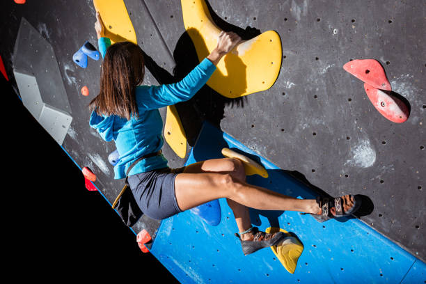 istock Girl climbing on a climbing wall 1467859365