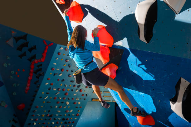 istock Girl climbing on a climbing wall 1467859392