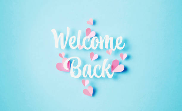 istock Welcome Back Phrase Surrounded By Pink Heart Shapes On Blue Background 1467859436