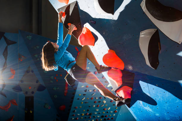 Girl climbing on a climbing wall