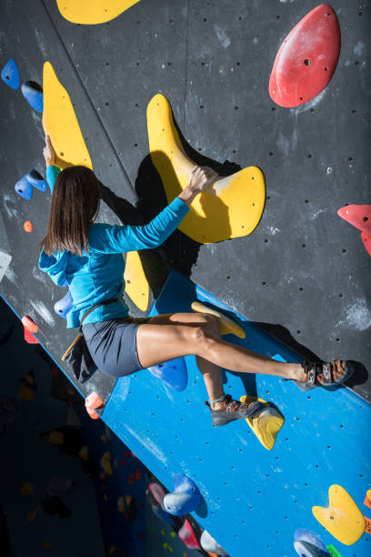 istock Girl climbing on a climbing wall 1467859504