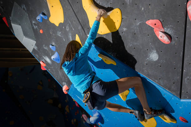 istock Girl climbing on a climbing wall 1467859605