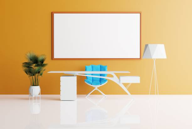 istock View of a modern office with an empty picture frame on a orange wall, background. 1467859741