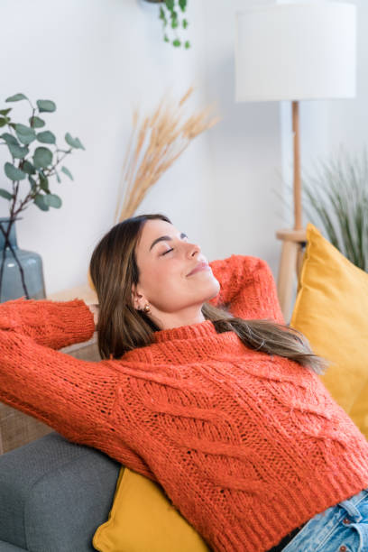 istock Young woman lying on sofa 1467861797