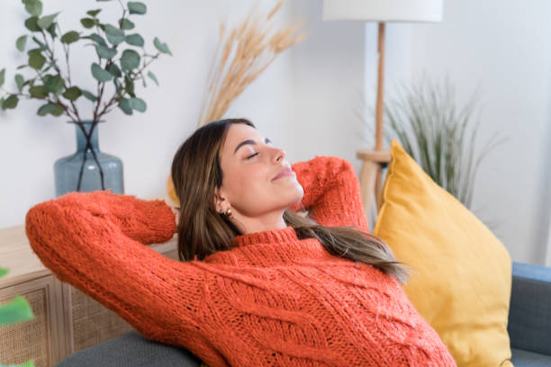 istock Young woman lying on sofa 1467861884