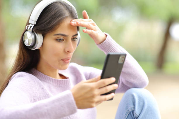 istock Woman surprised watching media on phone 1467862288