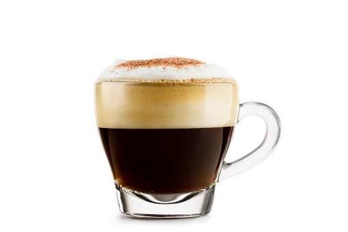 Cappuccino in glass cup on white background