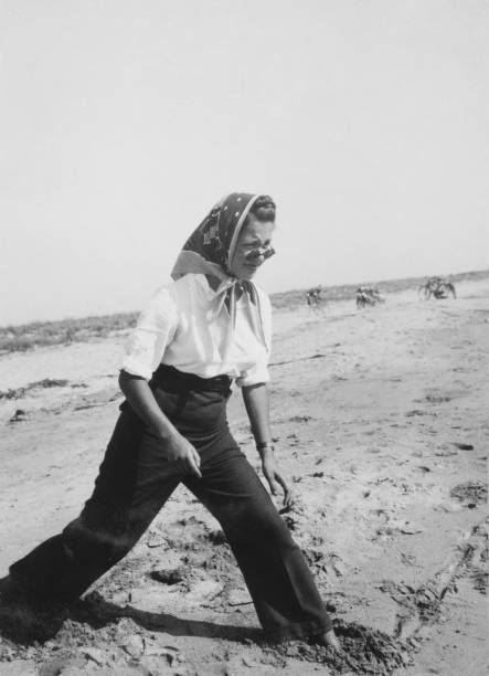 istock Young woman at the beach, 1941. 1467863728