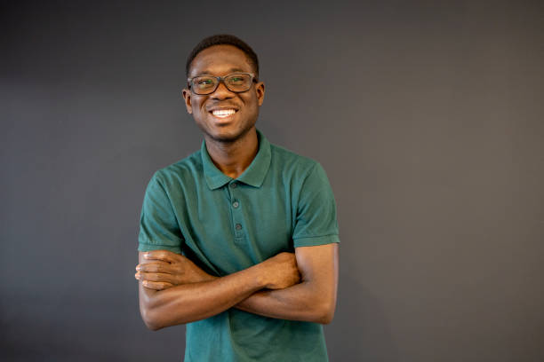 istock Shot of a handsome young man standing against a grey background 1467863756
