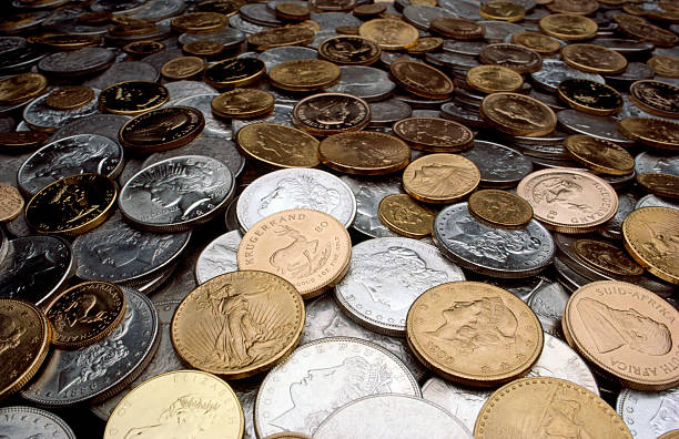 Gold & Silver Coins Heap of rare gold and silver coins. money shortage stock pictures, royalty-free photos & images