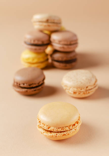 istock Pastel shades french macarons or macaroons (almond cookies) on the  background 1467868104