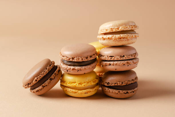 istock Pastel shades french macarons or macaroons (almond cookies) on the  background 1467868129
