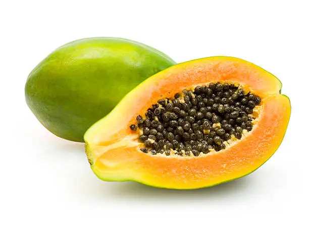 papaya with a slice isolated on white background