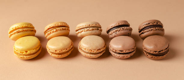 istock Pastel shades french macarons or macaroons (almond cookies) on the  background 1467868472