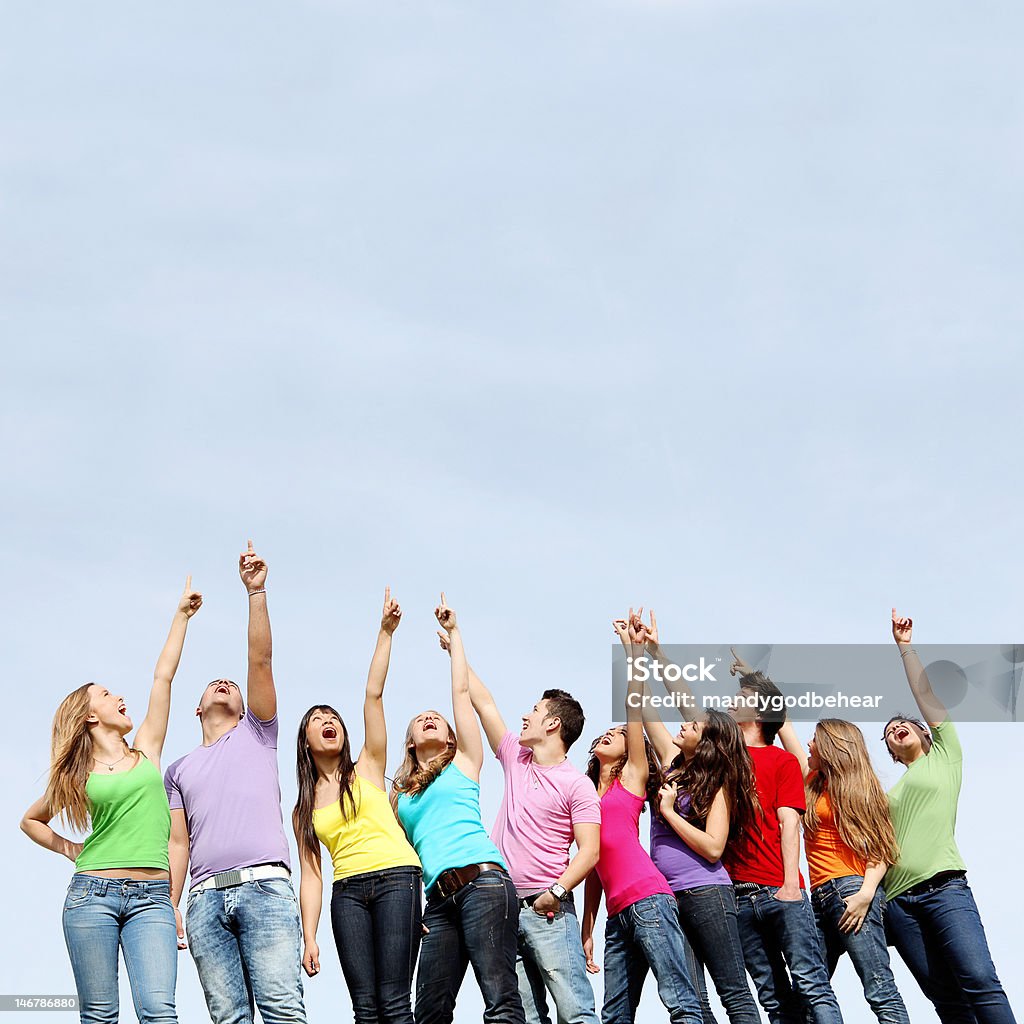 group of kids pointing up group of kids pointing up while singing or shouting. Summer Camp Stock Photo