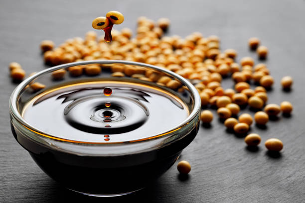 istock soy sauce drop falling from flying soybeans in glass bowl and created splash on black stone background 1467870161