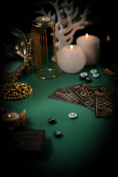 istock Defocused still Life with tarot cards. magic or fortune telling rite with occult and esoteric symbols. 1467870532