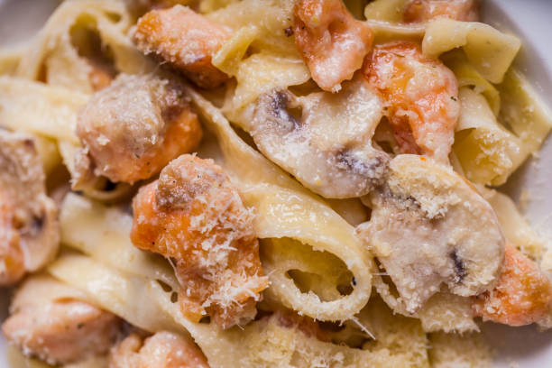 istock Pasta with meat, champignon, cheese, on a plate on the table 1467870637
