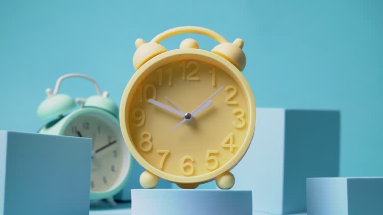 Spring time change 2023, daylight saving time spring forward: This stock footage captures the arrival of spring and the switch to daylight saving time. The clock hands move forward as the hour advances, showcasing the arrival of longer, sunnier days in a