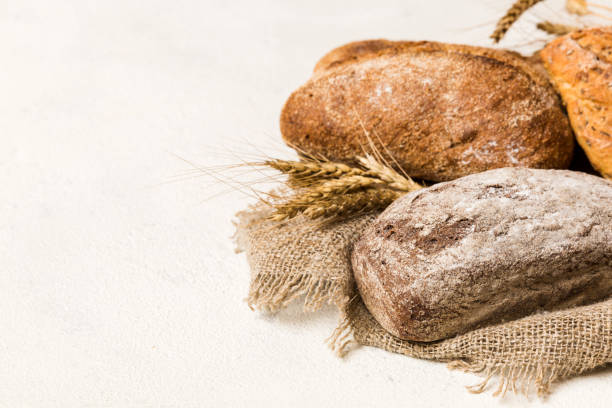 istock Homemade natural breads. Different kinds of fresh bread as background, perspective view with copy space 1467870938