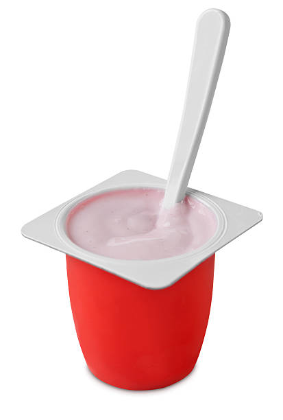 Kids yogurt container with spoon stock photo