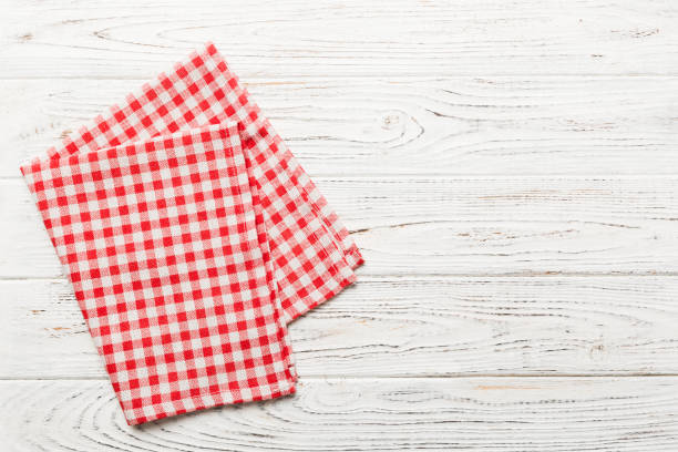 istock top view with red empty kitchen napkin isolated on table background. Folded cloth for mockup with copy space, Flat lay. Minimal style 1467871011