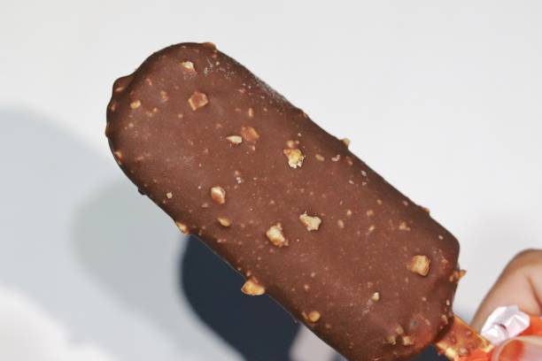 istock chocolate ice cream covered with peanuts on a white background 1467871573