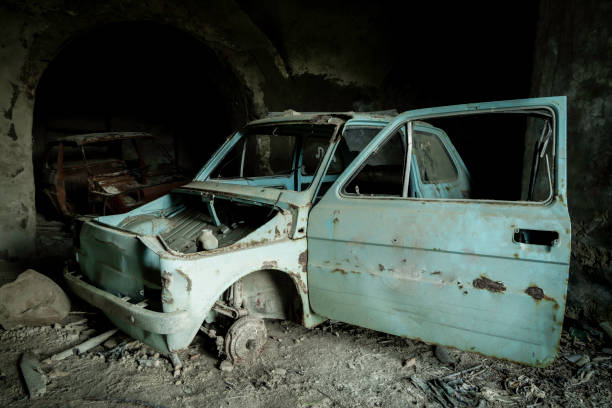 istock Abandoned car in ancient garage 1467873548