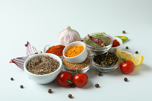 Concept of aromatic spices on white background