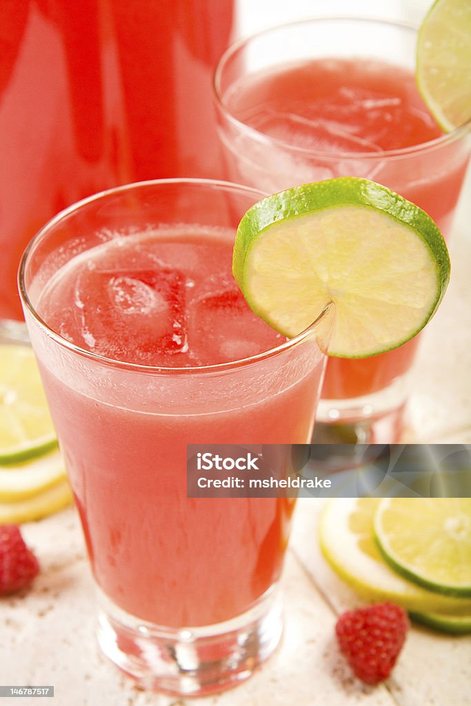Watermelon Punch Ice cold water melon punch with ice on white tile Berry Fruit Stock Photo