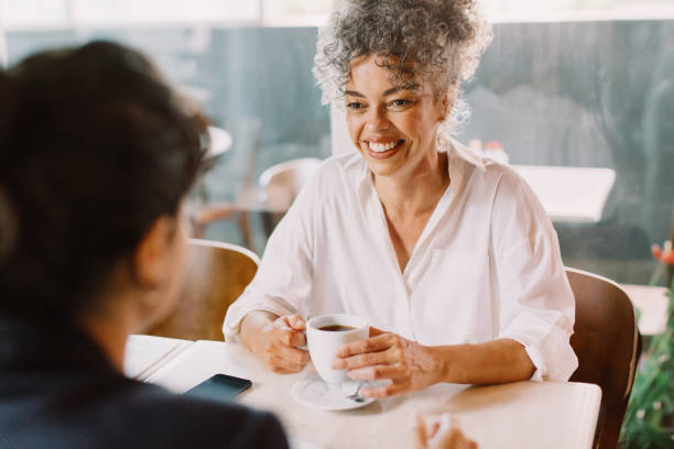 istock Friends catching up in a coffeeshop 1467876204