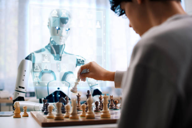 défi d’échecs : affrontement entre garçon et robot - chess skill concentration intelligence photos et images de collection