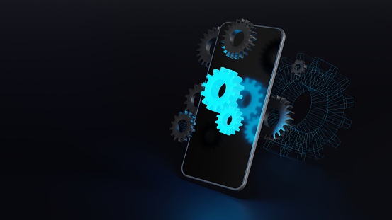 Cell phone on a dark background with glowing and metallic gears