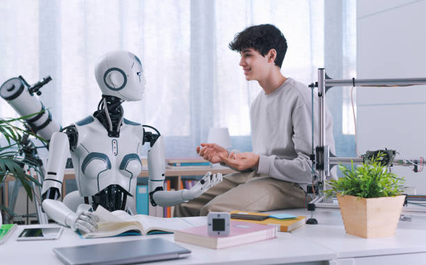 A Boy studies with the help of a Robot. The result is fruitful. Robot and Human Collaboration Concept.