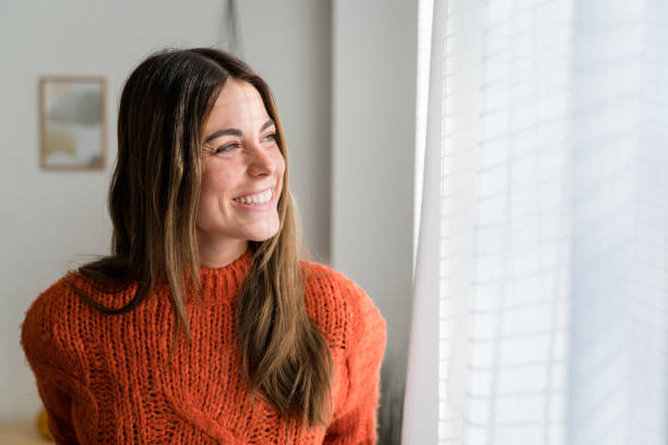 istock Smiling woman with long hair looking at camera 1467877802
