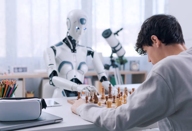 istock Concentrated chess game between boy and robot 1467877860