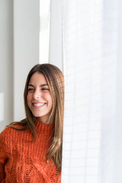 istock Smiling woman with long hair looking at camera 1467877915