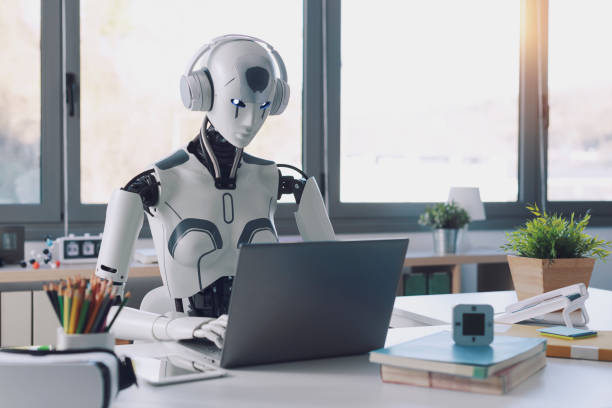 Humanoid Robots Revolutionizing Mundane Tasks A humanoid robot works in an office on a laptop to listening Music in  Headphone, showcasing the utility of automation in repetitive and tedious tasks. man and machine stock pictures, royalty-free photos & images