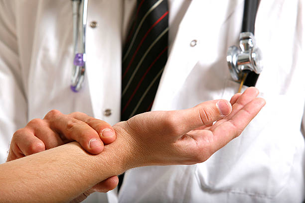 doctor checking patient stock photo