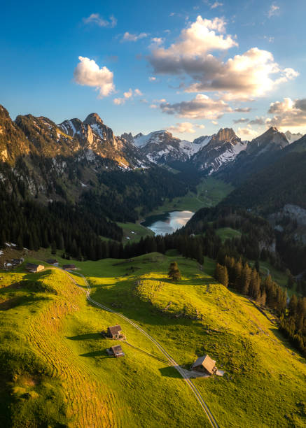 istock A farm in the valley next to a mountain lake 1467882103