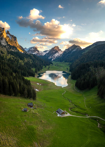 istock A farm in the valley next to a mountain lake 1467882104