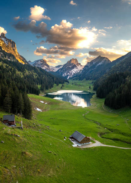 istock A farm in the valley next to a mountain lake 1467882142