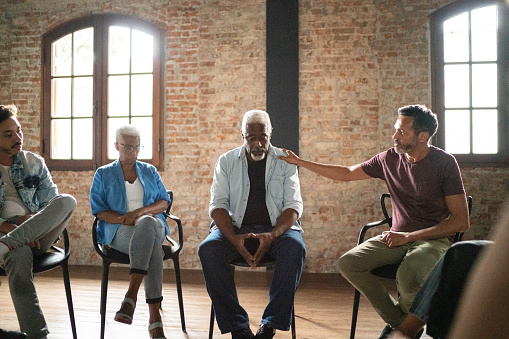 Senior man receiving a advice during a psychotherapy
